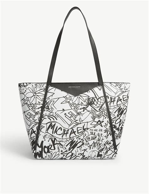 michael kors black and white graffiti design backpack|Michael Kors belt backpack.